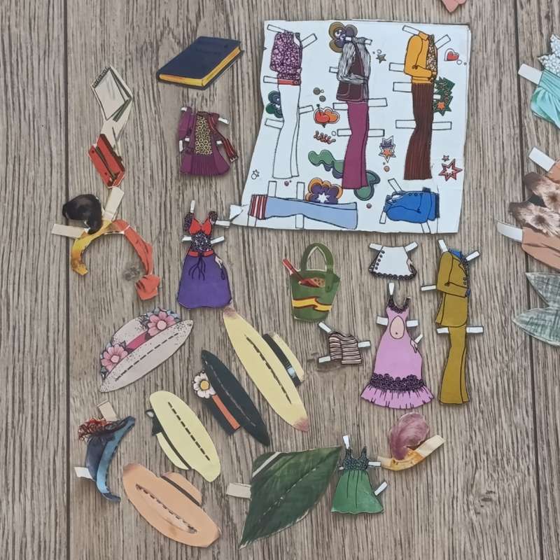 Large lot of vintage paper dolls with various dresses