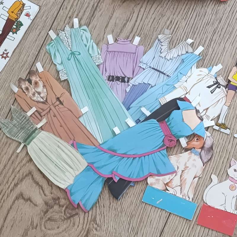 Large lot of vintage paper dolls with various dresses