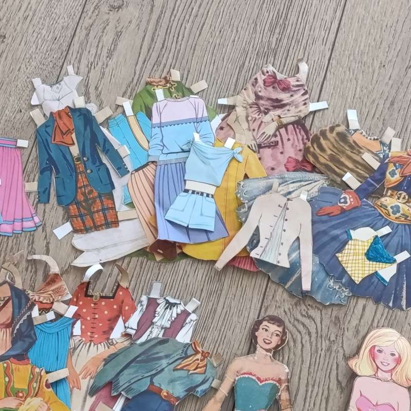 Large lot of vintage paper dolls with various dresses