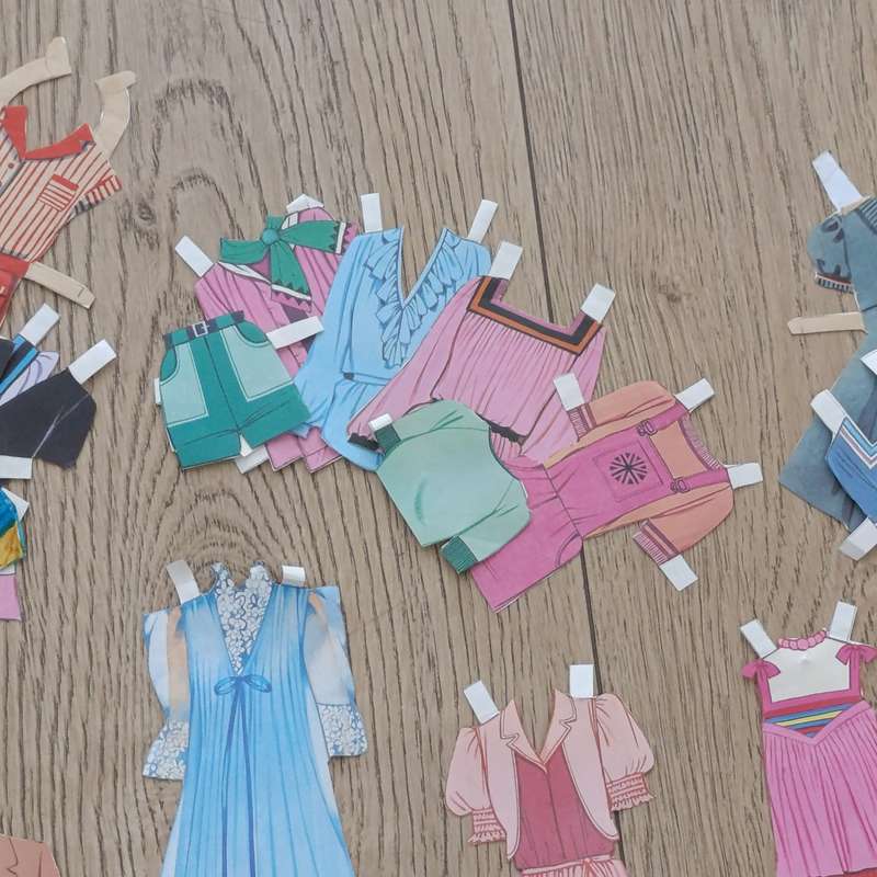 Large lot of vintage paper dolls with various dresses