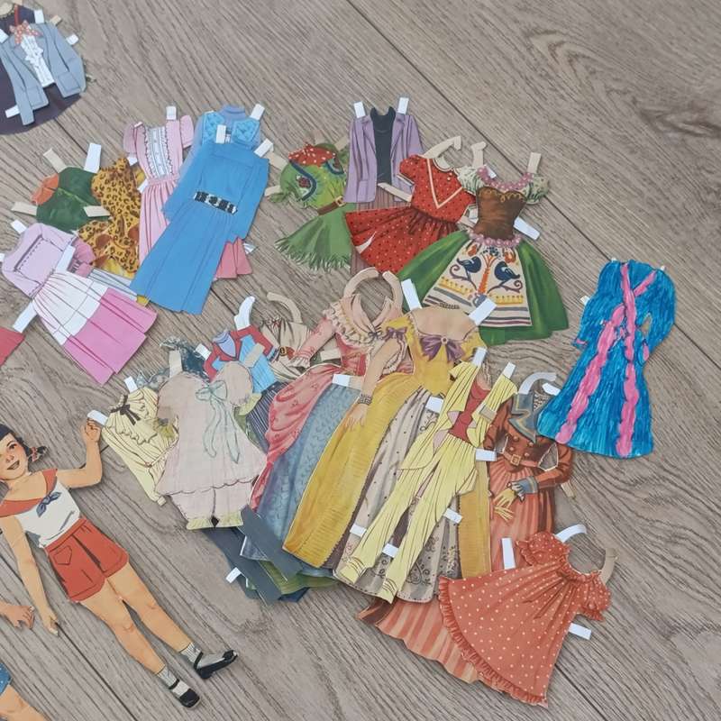 Large lot of vintage paper dolls with various dresses