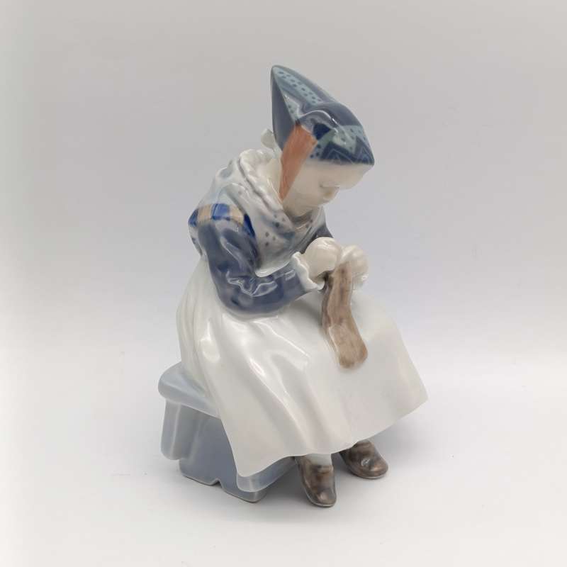 Vintage Royal Copenhagen girl sewing porcelain figurine