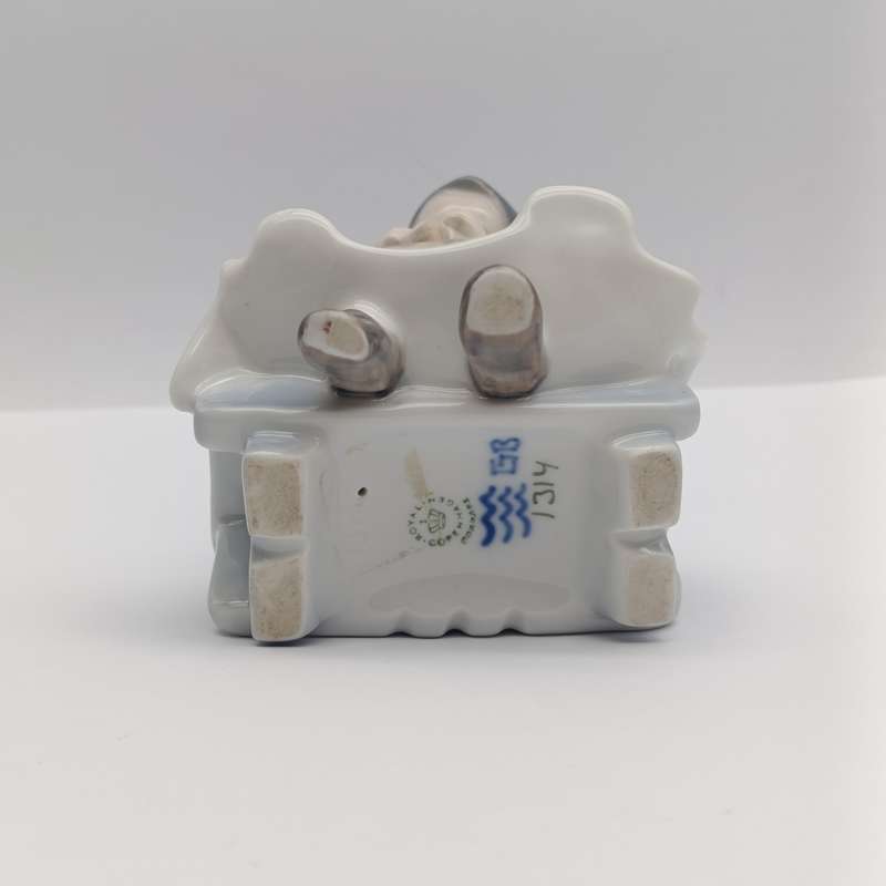 Vintage Royal Copenhagen girl sewing porcelain figurine