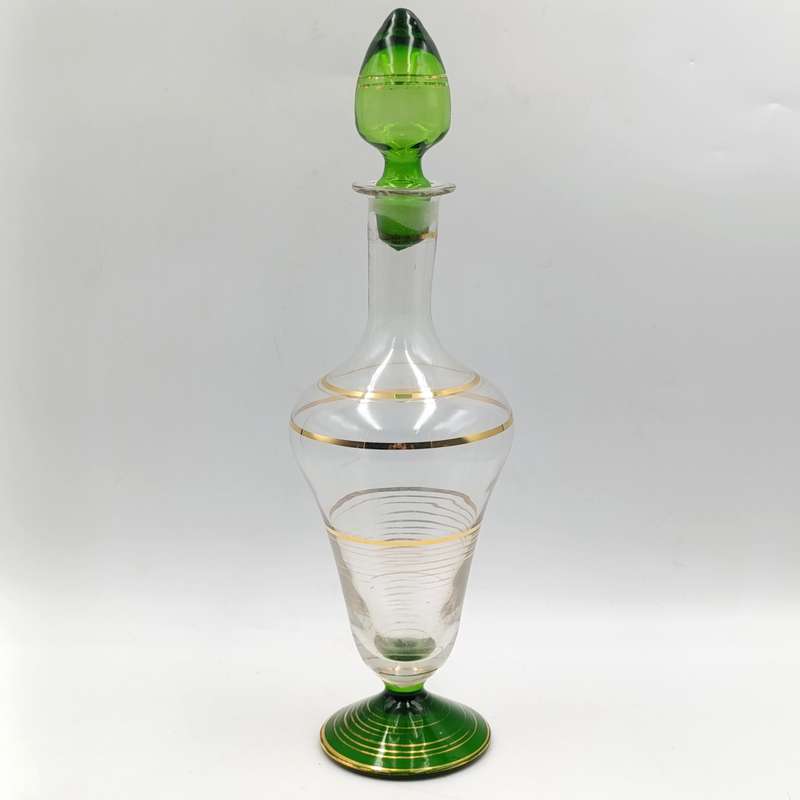 Beautiful vintage glass decanter with green glass top