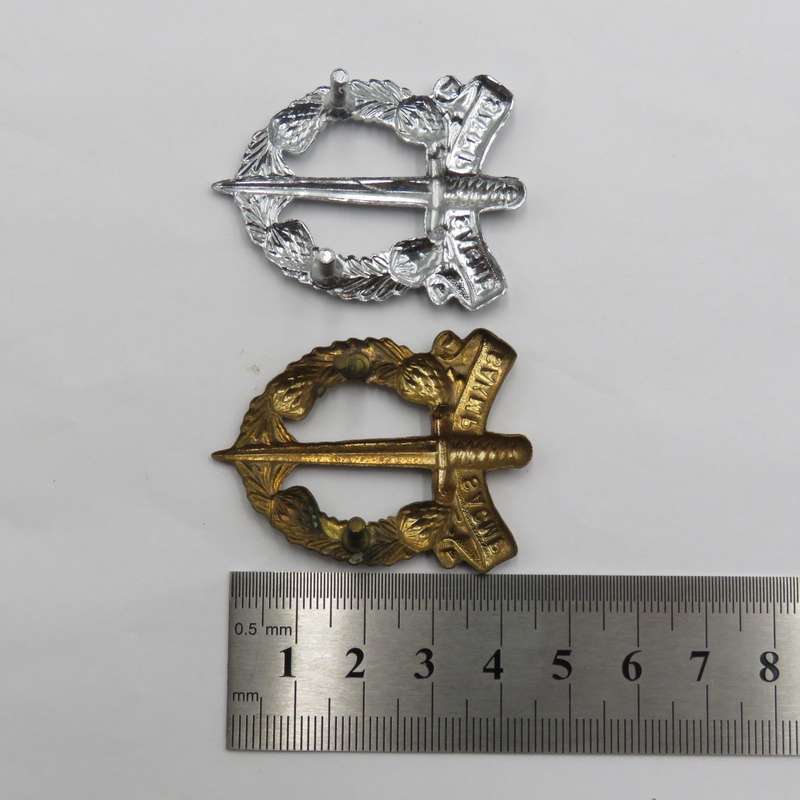 Lot of 2 different SA Corps of Military Police cap badges