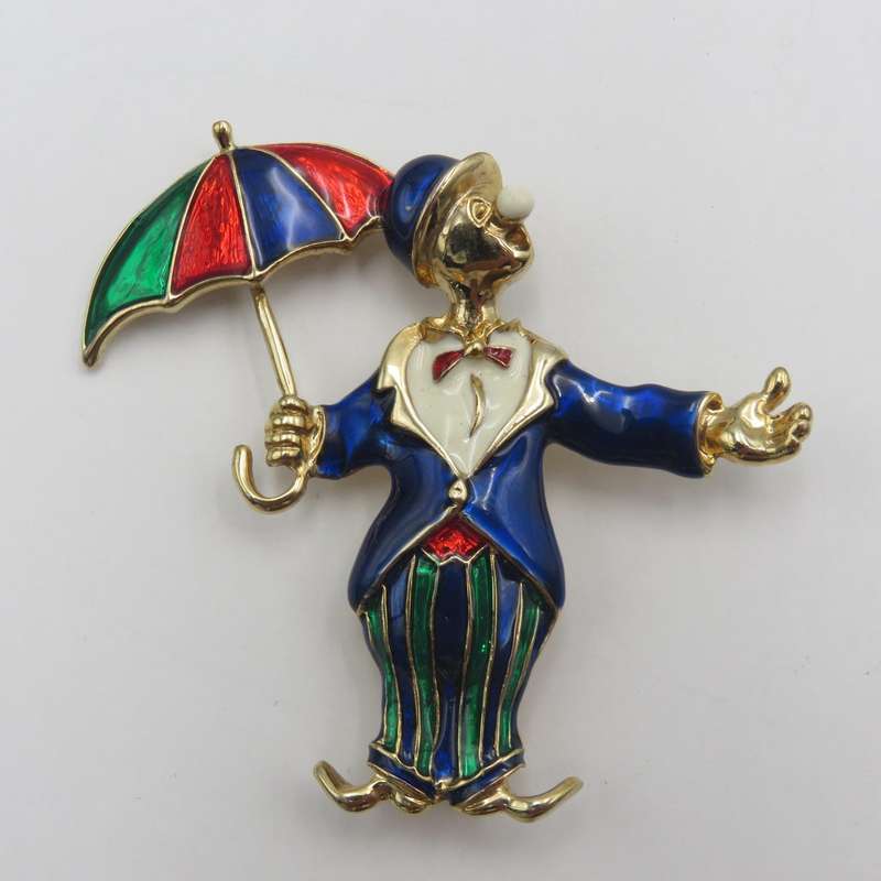 Vintage gold colour with enamel clown brooch