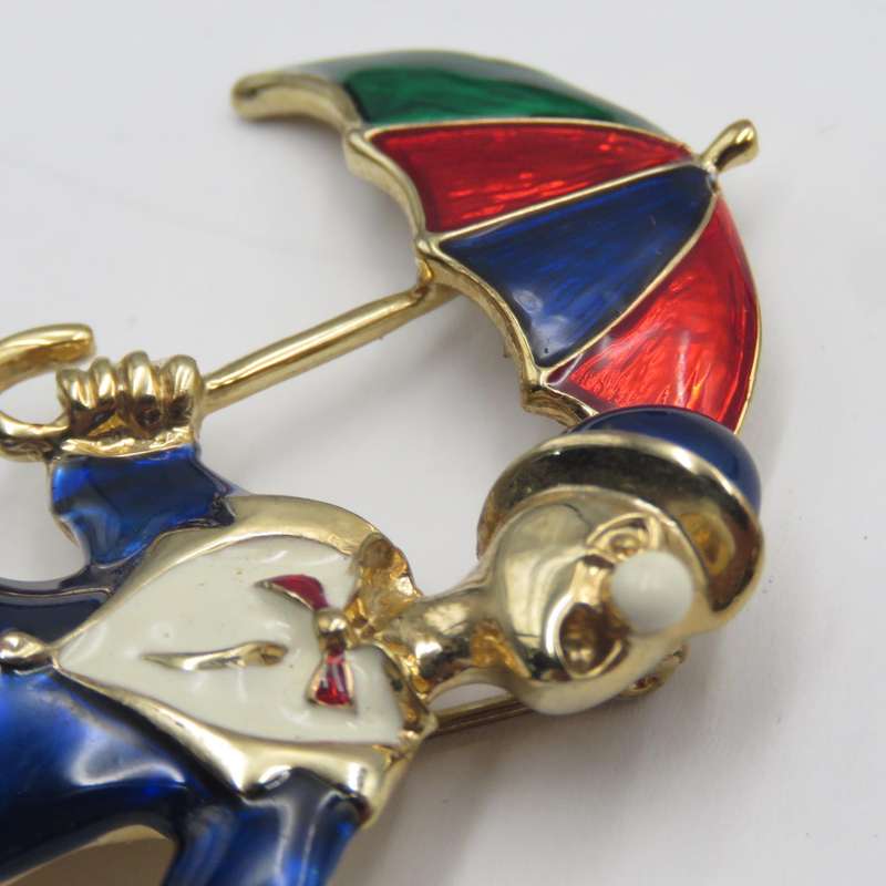 Vintage gold colour with enamel clown brooch