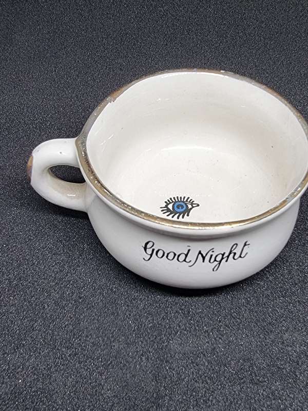 Vintage miniature cup with eye