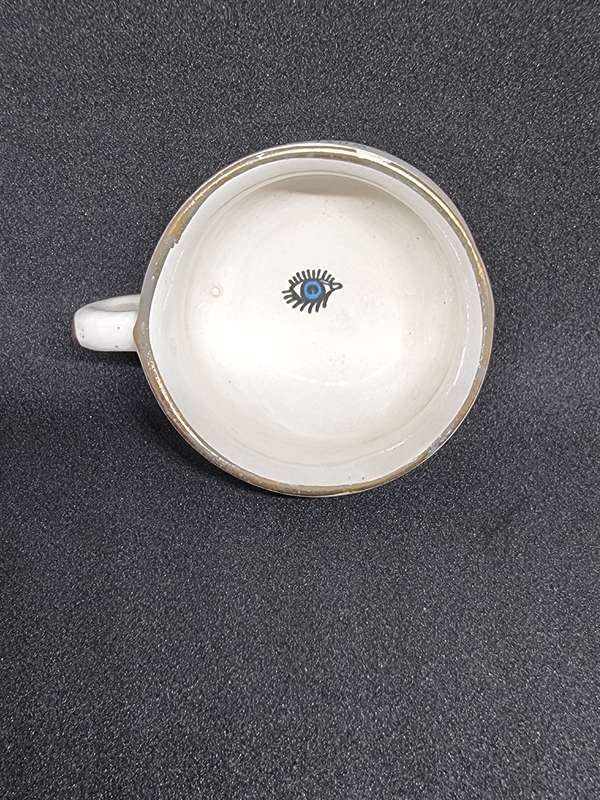 Vintage miniature cup with eye