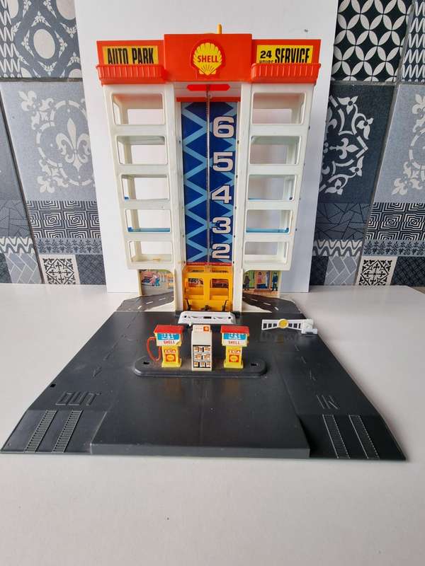 Vintage 6 Story Shell Parking Garage with Gas Station and Elevator