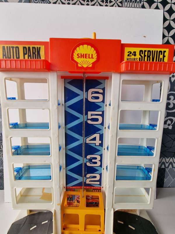 Vintage 6 Story Shell Parking Garage with Gas Station and Elevator