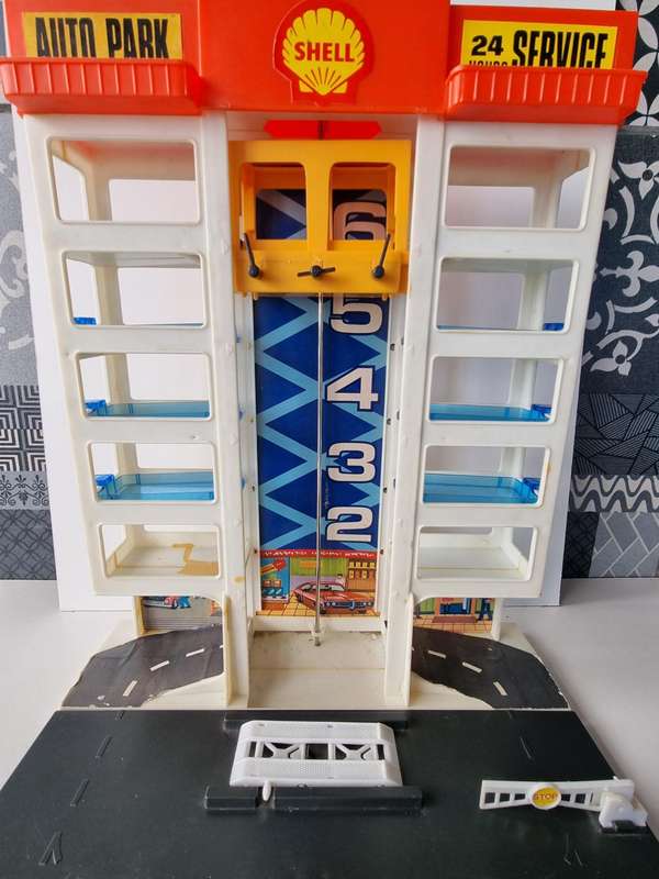 Vintage 6 Story Shell Parking Garage with Gas Station and Elevator