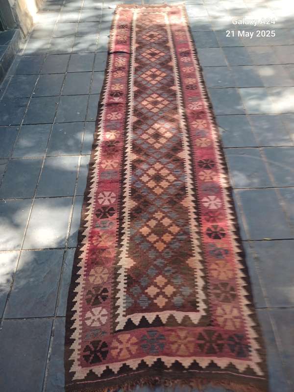 A hand knotted Kelim runner