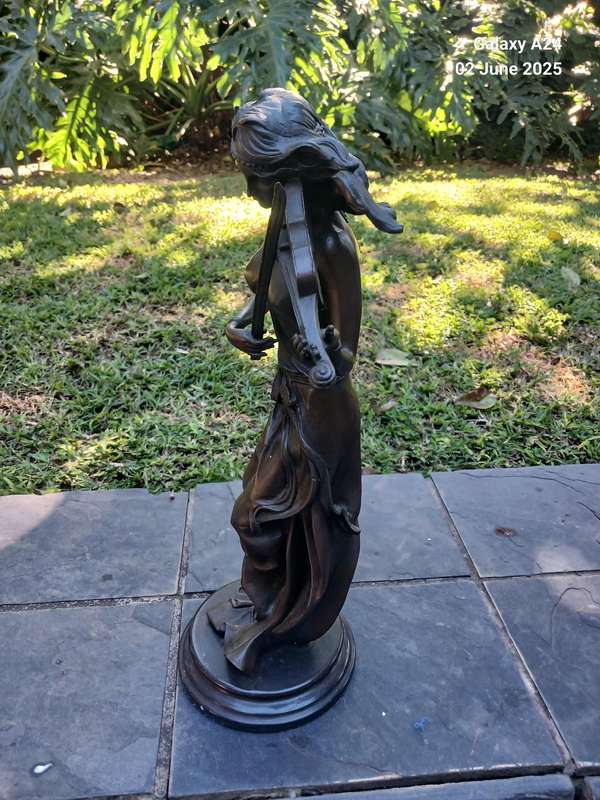 Bronze figurine of a lady playing the violin