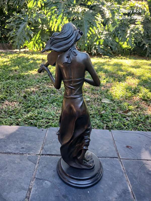 Bronze figurine of a lady playing the violin