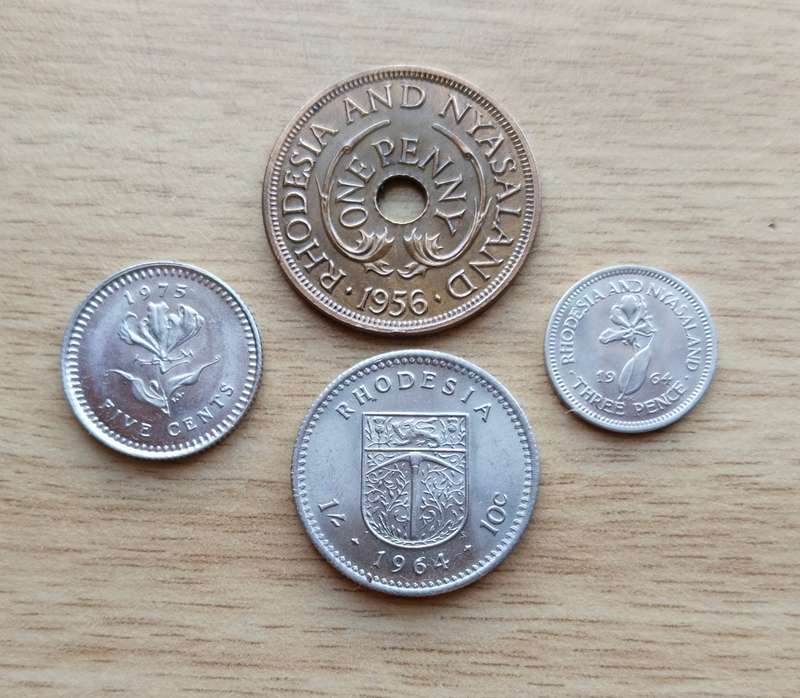 Collection of 4 UNC Rhodesia coins.