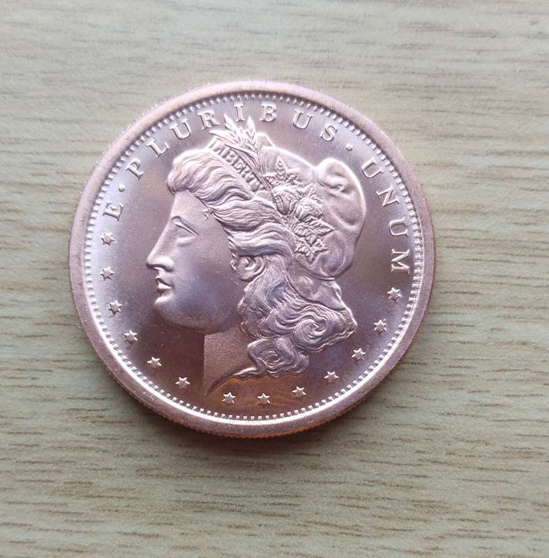 America 1 OZ .999 Fine copper Morgan Dollar.
