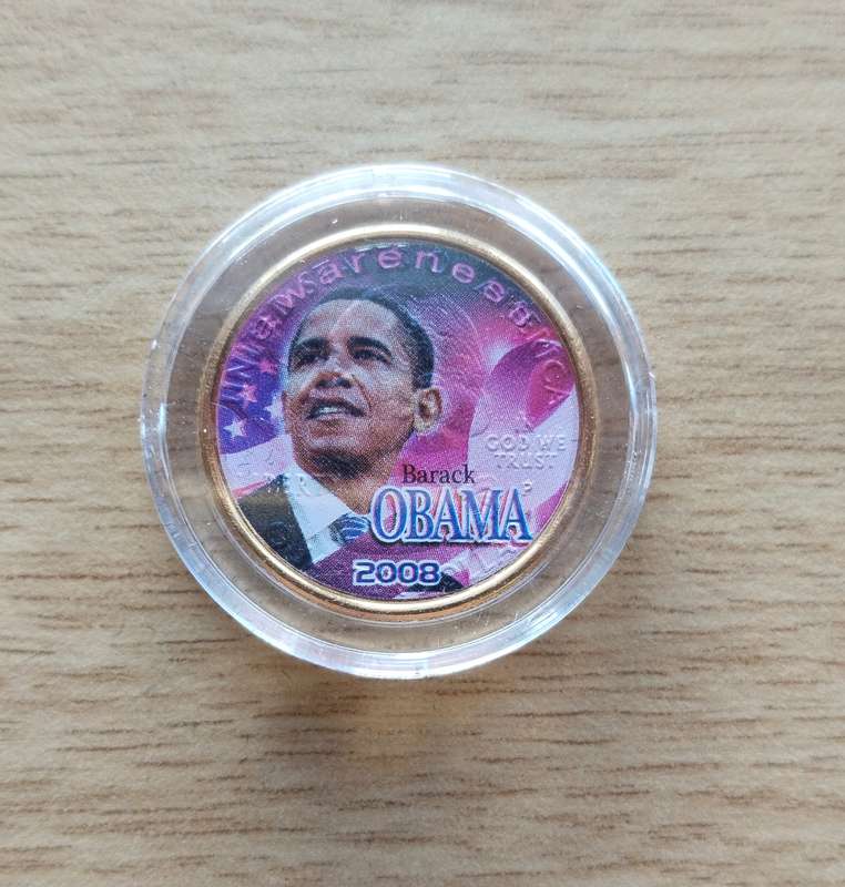 America Gold coloured Obama certified quarter dollar.