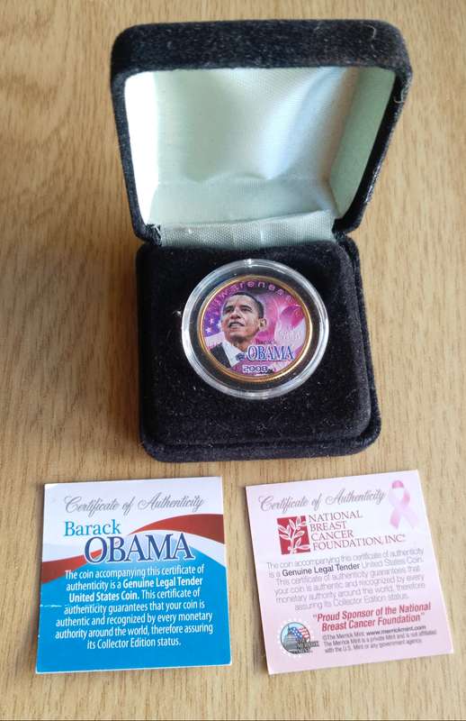 America Gold coloured Obama certified quarter dollar.