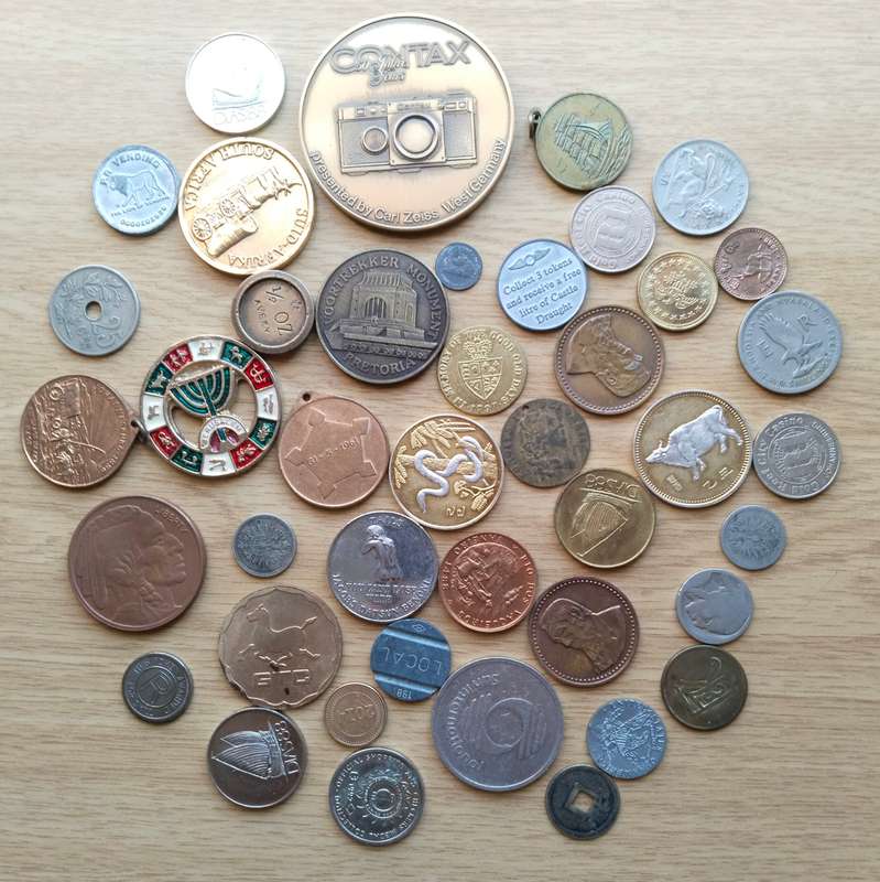 Large collection of tokens and coins from around the world. One bid takes all.