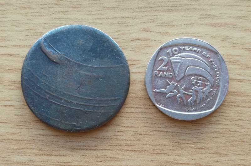 T.P. STAPLES 1895 Old 2/- Token. R2 just for size.