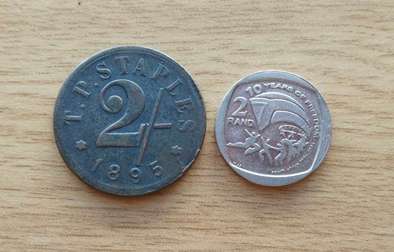 T.P. STAPLES 1895 Old 2/- Token. R2 just for size.