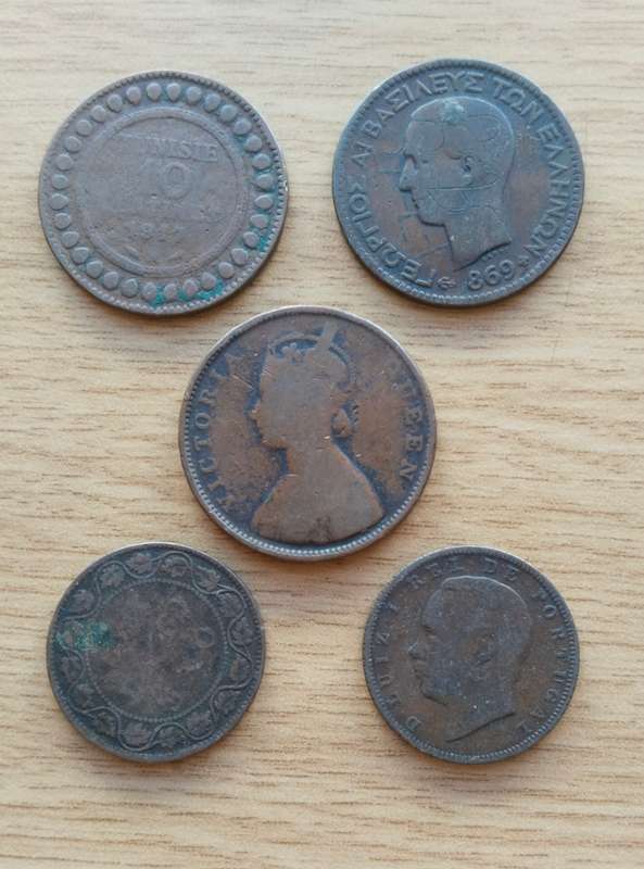 Collection of 5 old copper coins from around the world.