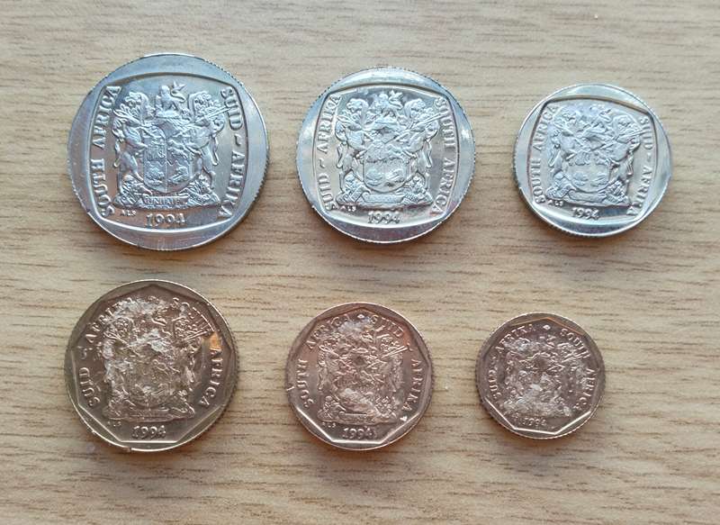 South Africa 1994 Proof coins. 50,20 and 10 cents where stuck to something.