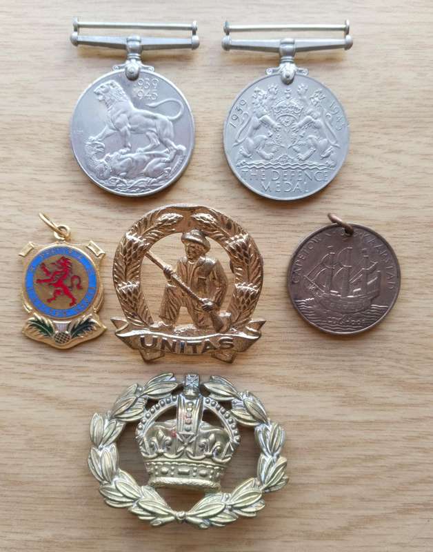 Collection of 6 Old military badges and Medals.