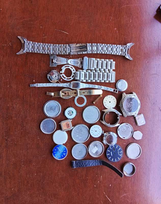 AMAZING WATCH MAKERS COLLECTION OF WATCH MOVEMENTS, BELTS,BRACELETS AND FACES