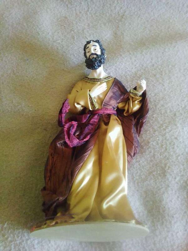 Biblical disciple figurine on stand