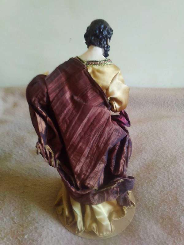 Biblical disciple figurine on stand