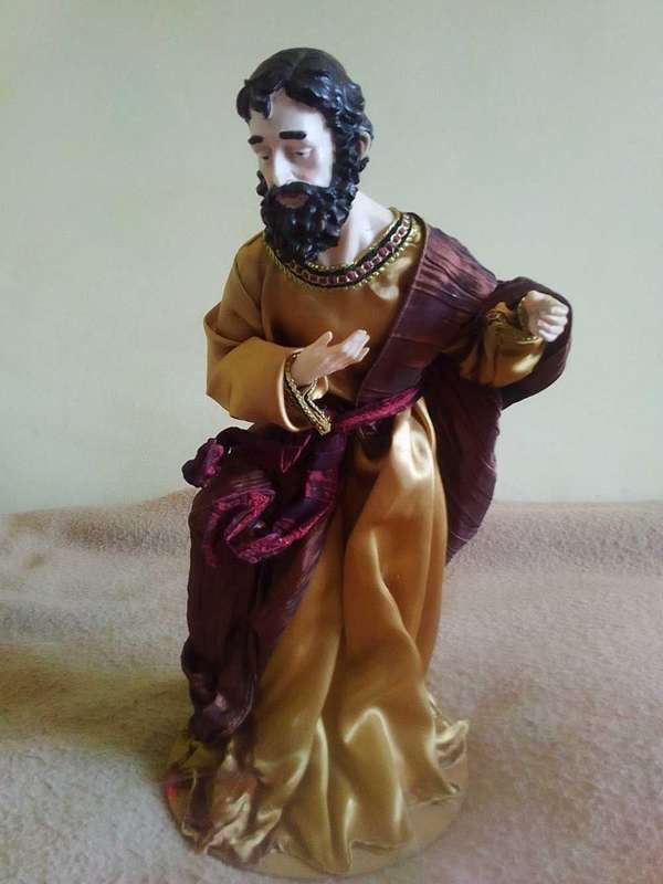 Biblical disciple figurine on stand
