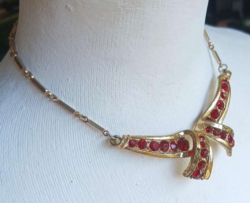 Vintage Gold Tone and Ruby Red Rhinestone Bow Pendant Necklace by Coro