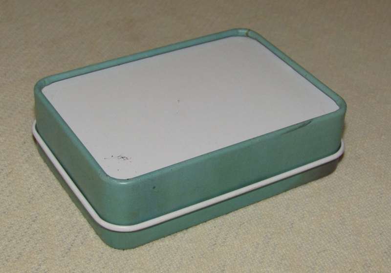 Contemporary Collectible Small Turquoise Storage Tin Featuring Marilyn Monroe - Pin-Up Style
