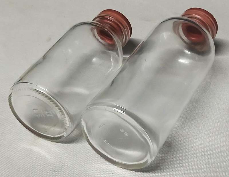 Pair of Vintage Apothecary Bottles | Clear Glass with Rubber Stoppers | Mid-Century Medical Style