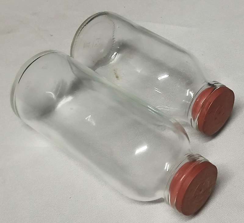 Pair of Vintage Apothecary Bottles | Clear Glass with Rubber Stoppers | Mid-Century Medical Style