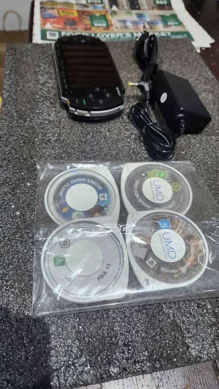 PSP Phat E1004 2gb with 4X games with pouch and charger- portable handheld