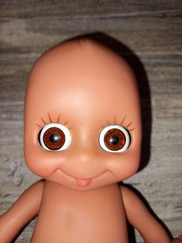 Kewpie doll, anatomically correct male, with googly eyes