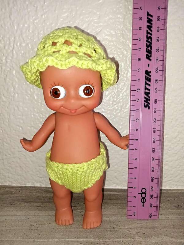 Kewpie doll, anatomically correct male, with googly eyes