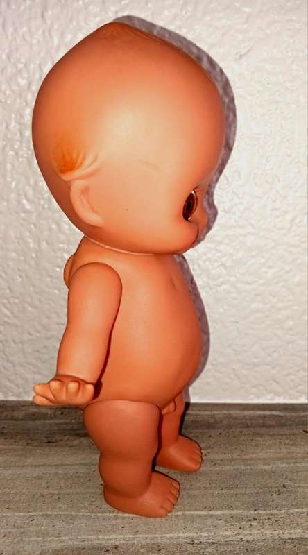 Kewpie doll, anatomically correct male, with googly eyes