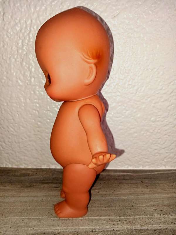 Kewpie doll, anatomically correct male, with googly eyes