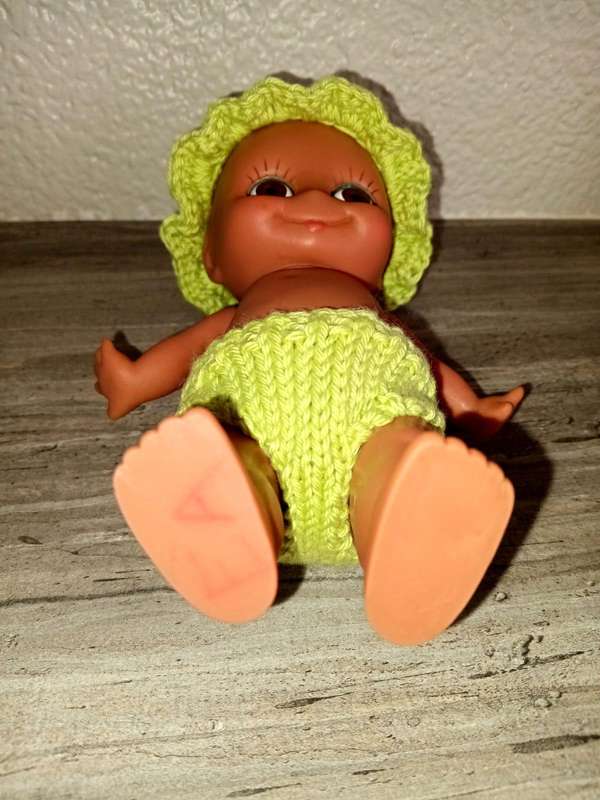 Kewpie doll, anatomically correct male, with googly eyes
