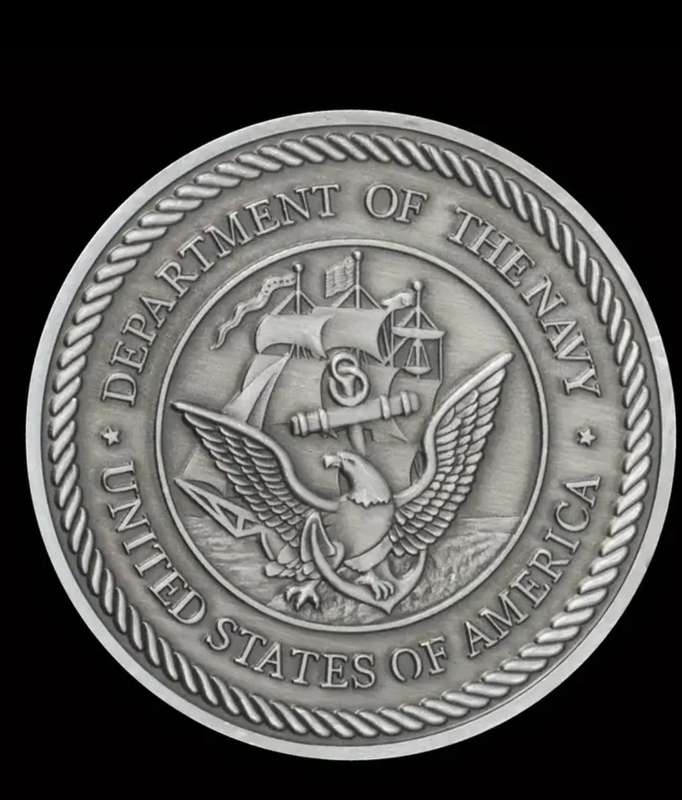 A Commemorative Coin Of The US Navy F-14 Tomcat Fighter Jet in Protective capsule.