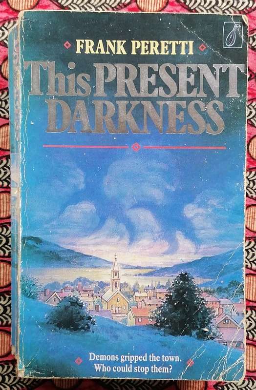 This Present Darkness by Frank Peretti