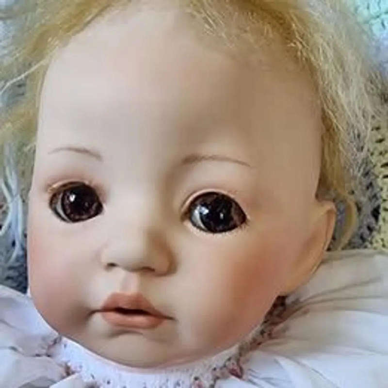Sweet happy porcelain baby girl doll