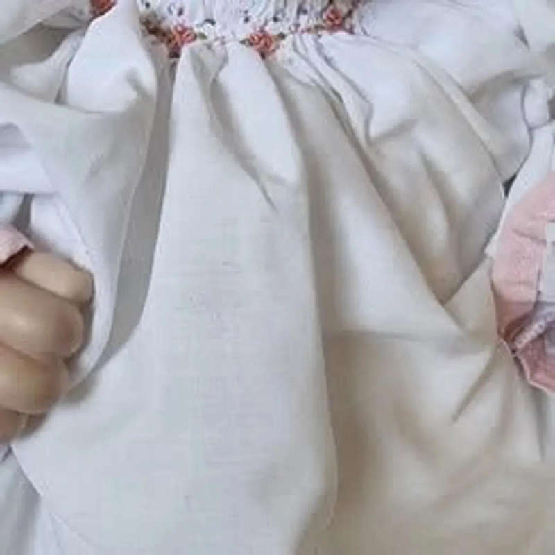 Sweet happy porcelain baby girl doll
