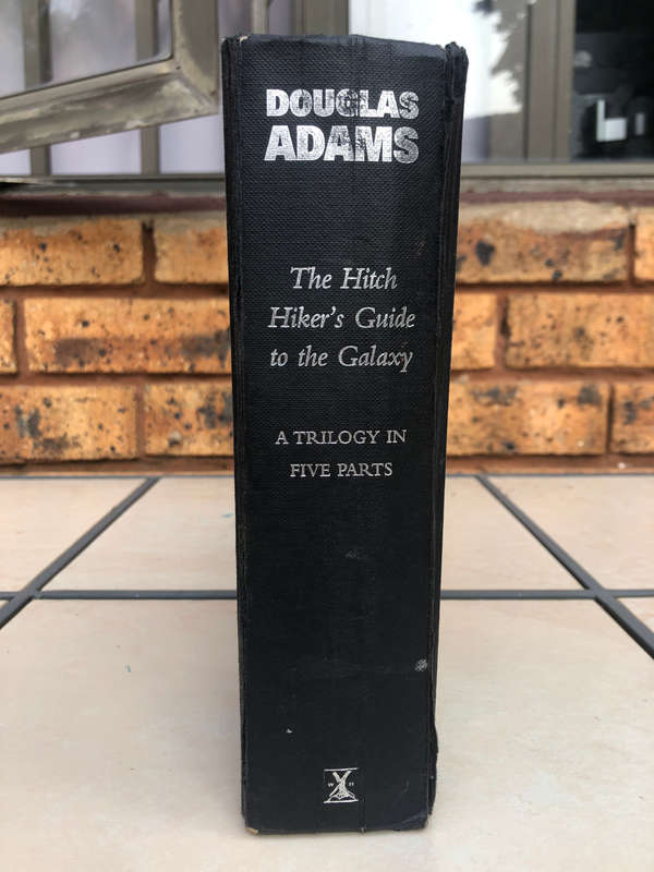 "The Hitch Hiker's Guide to the Galaxy: A trilogy in five parts" book, by Douglas Adams