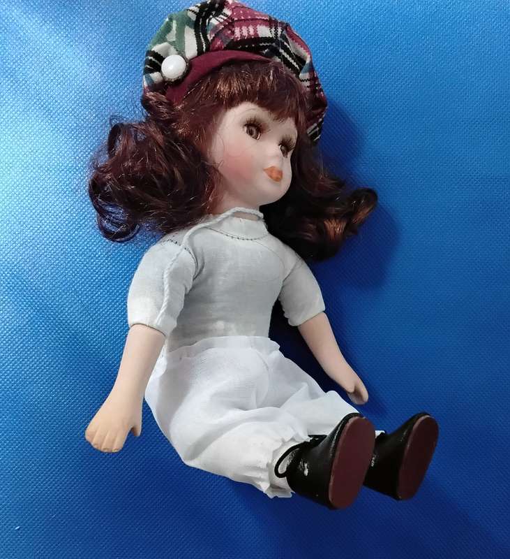Small Vintage Porcelain Doll in sitting Position