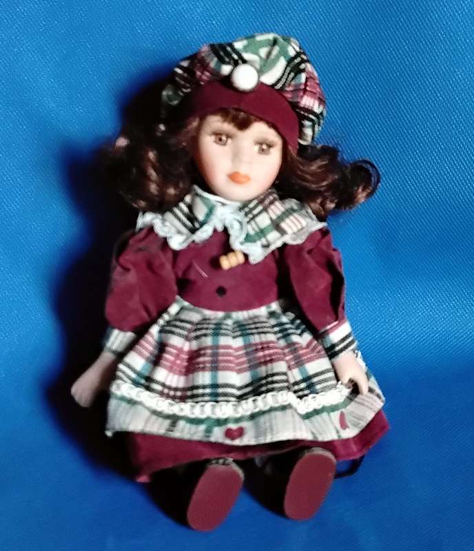 Small Vintage Porcelain Doll in sitting Position